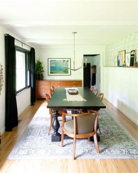 Light Bright Dining Room With Wallpapered Chair Rail And Dark Curtains