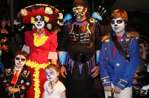 group of people dressed up in costumes at outdoor event