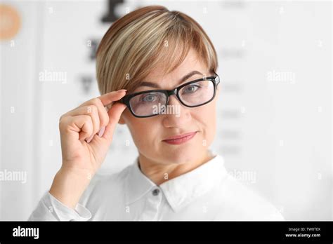 Mature Woman Wearing Glasses In Ophthalmologist S Office Stock Photo