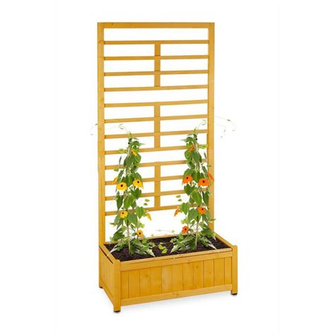 A Wooden Planter With Plants Growing In It