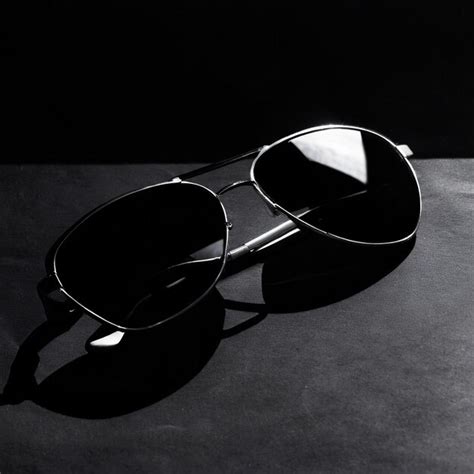 Premium Photo A Pair Of Sunglasses On A Black Background