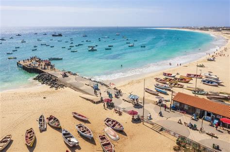 Pier And Boats On Turquoise Water In City Of Santa Maria Sal Cape