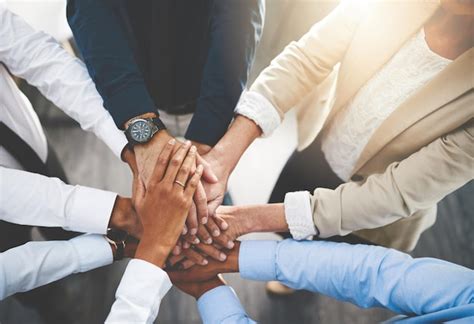 Premium Photo Midsection Of Business Colleagues Stacking Hands