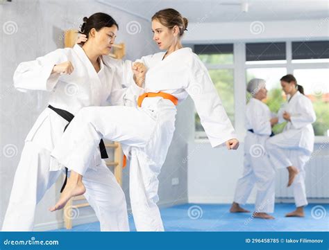 Young Female Karateka Honing Knee Strike Technique during Kumite Stock ...