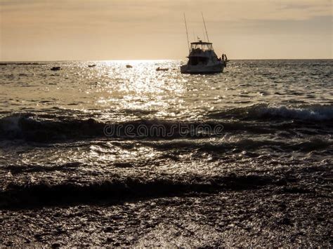 Boat Silhouette at Sunset stock image. Image of landscape - 174259107