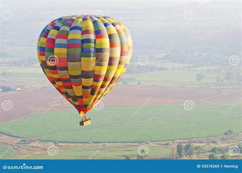 Hot Air Balloon Over Fields Stock Image Image Of Colors Bright