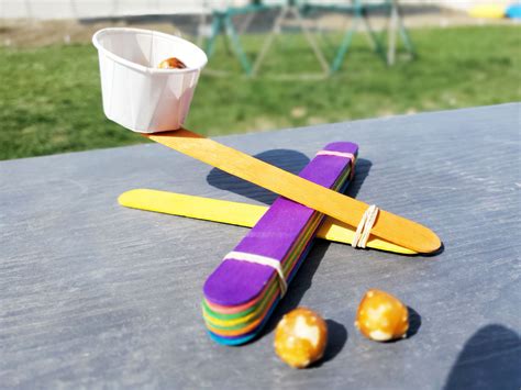 Launch into fun with a DIY popsicle stick catapult - My Silly Squirts