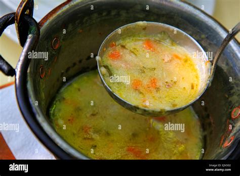 Pig Iron Saucepan With Vegetable Soup And A Scoop Stock Photo Alamy