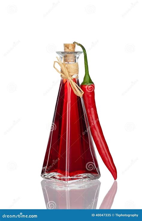 Bottle Chili Oil And Chili Pepper With Real Reflection Stock Image