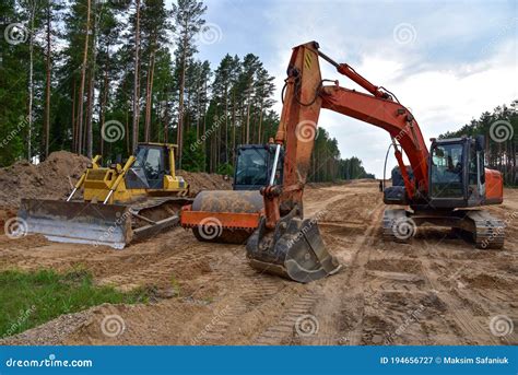 Bulldozer Excavator And Soil Compactor On Road Work Earth Moving