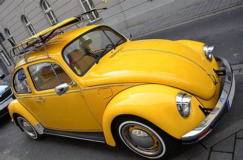 Royalty Free Photo Yellow Volkswagen Beetle Couple On Roadway Near Gray Building Pickpik