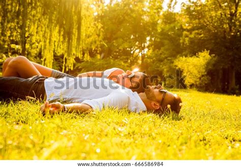 Beautiful Young Couple Laying Grass Park Stock Photo 666586984 ...