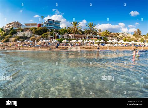 People relaxing on Coral Bay Beach, one of the most famous beaches in ...