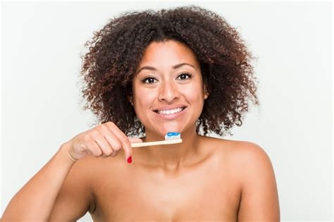 Premium Photo Close Up Of A Young African American Woman Brushing Her