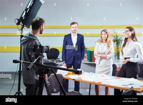 film director discussing  plan   actors   office scene