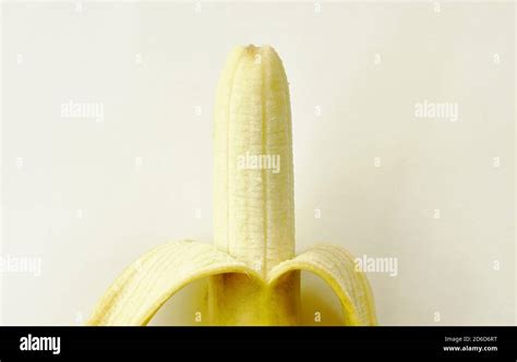 golden banana peel out on white background Stock Photo - Alamy