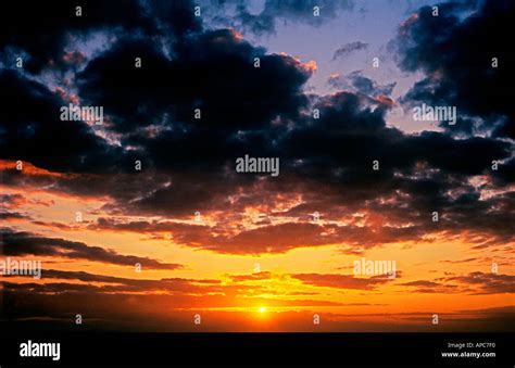 sunset dramatic clouds Stock Photo - Alamy