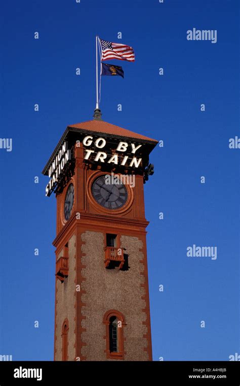 USA flag flies from top of Union Station clock tower in Portland Oregon ...