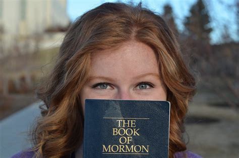 Sister Missionary Pose With The Book Of Mormon Sister Missionaries