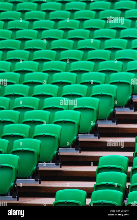 A Vertical Shot Of Green Stadium Seats And Staris Stock Photo Alamy