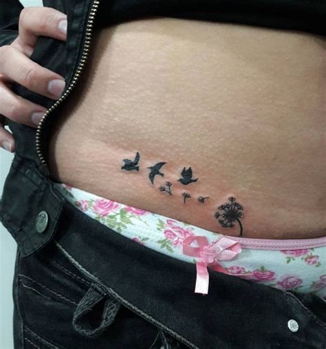 A Woman S Stomach With Birds And Flowers On The Side Which Has Pink