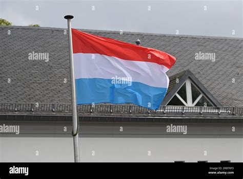 Marnach, Luxembourg. 28th May, 2023. The flag of Luxembourg flies in ...