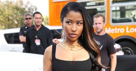 Nicki Minaj Accentuates Her Hourglass Curves In A Skintight Black Dress