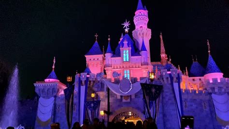 Admiring The Disney Sleeping Beauty Castle At Night Disneyland