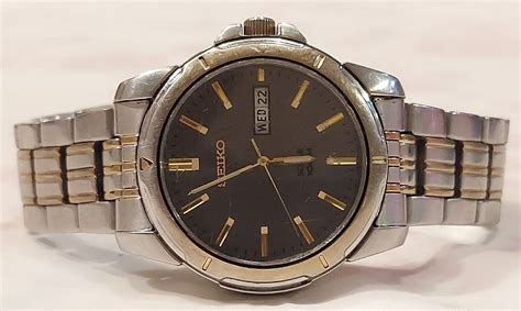 Seiko Sne098 Solar Quartz Stainless And Gold Tone Grey Dial V158 0ad0 Ebay