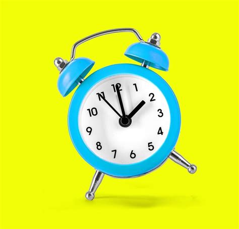 Premium Photo Blue Retro Alarm Clock On Yellow Background