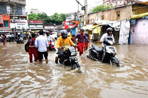 Patna Vehicles Wade Through A Waterlogged After A Heavy Rainfall