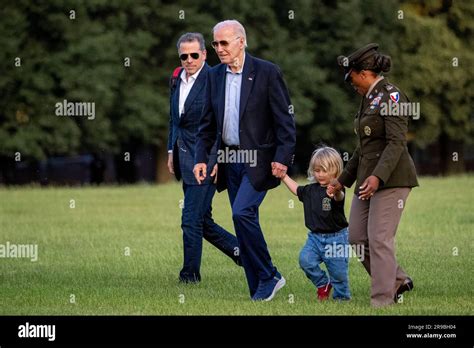 President Joe Biden walks with his grandson Beau Biden and his son ...