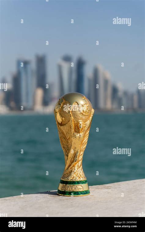 Fifa World Cup Trophy With Doha Corniche Qatar As The Background Stock