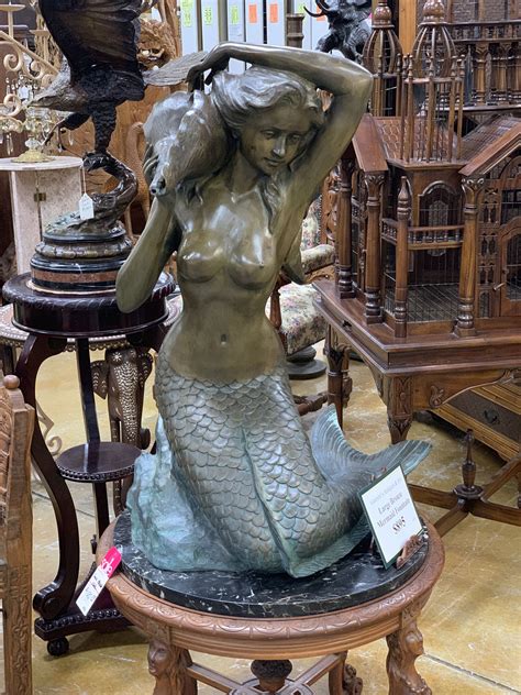 A Beautiful Mermaid Fountain That Would Be Perfect By Your Pool Side