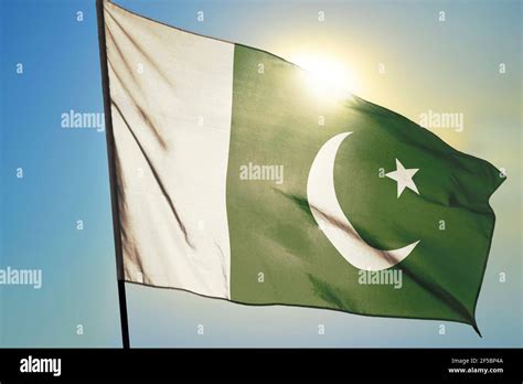 Pakistan Flag Waving On The Wind In Front Of Sun Stock Photo Alamy