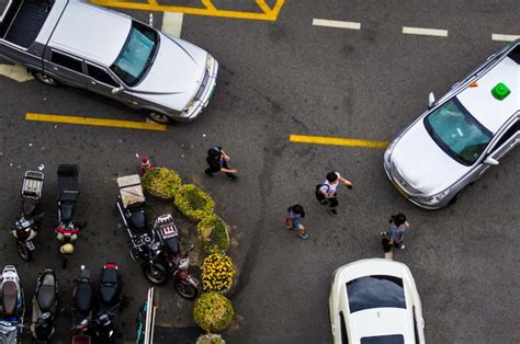 Premium Photo High Angle View Of People Walking On Road