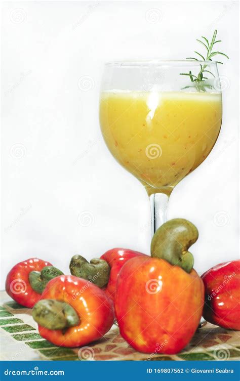 Natural Cashew Fruit Juice In Glass Bowl With Whole Fruits On Brabco ...