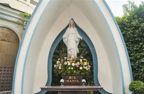 The Virgin Mary Statue is Positioned in a Beautiful Blue and White ...