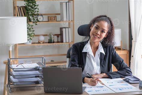 African American Businesswoman Working In The Office Using Laptops