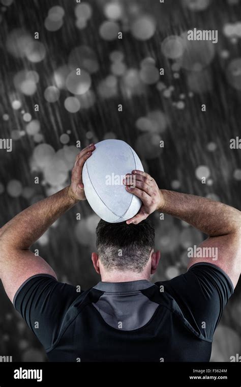 Composite Image Of Tough Rugby Player Throwing Ball Stock Photo Alamy