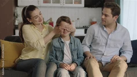 Wideo Stock Portrait Of Happy Modern Parents Giving A Soccer Ball To