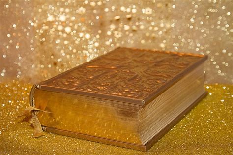 Royalty-Free photo: Bible on gold surface | PickPik