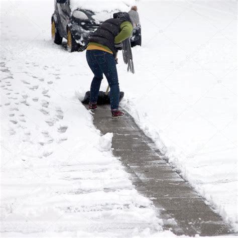 Person clearing snow off a pathway — Stock Photo © Farina6000 #22032341