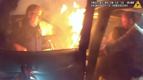 Watch Officers Good Samaritan Pull Woman From Burning Car