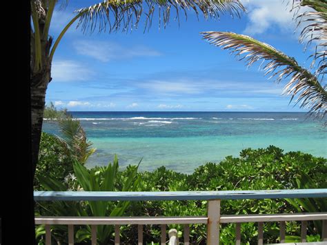 the ocean is clear and blue as seen from a balcony