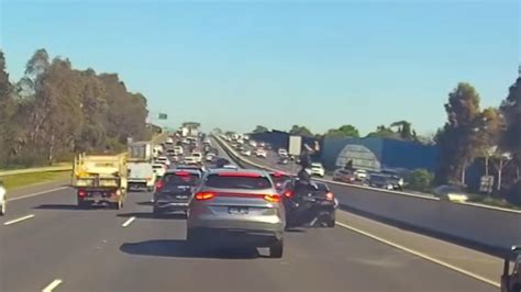 Incredible Moment Motorcyclist Flips On Top Of Car After Crashing Into