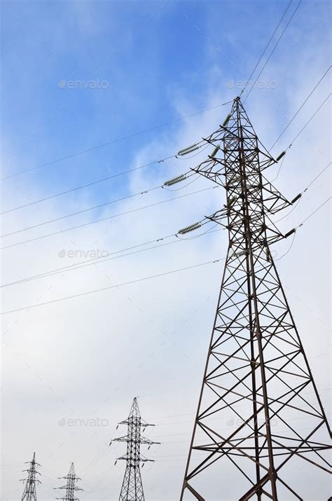 The Silhouette Of The Electricity Transmission Pylon In Daytime