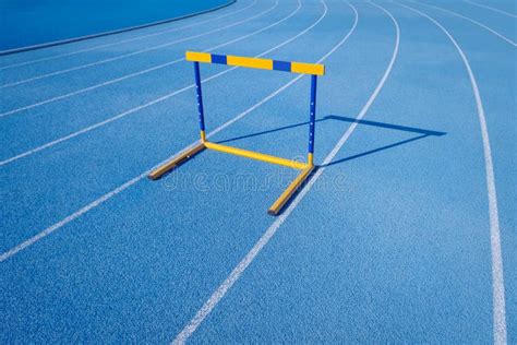 Hurdles on Athletic Running Track Stock Image - Image of marking, empty ...