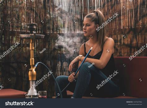 Young Beautiful Woman Smoking Hookah Having Stock Photo 1547607962 ...