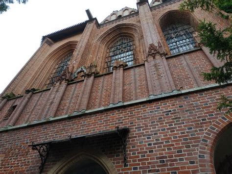 An Old Brick Building With Arched Windows